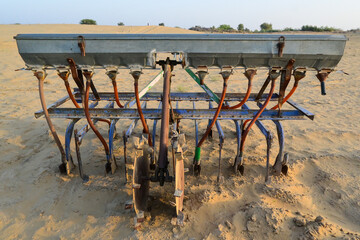 closeup of old seed planter machine