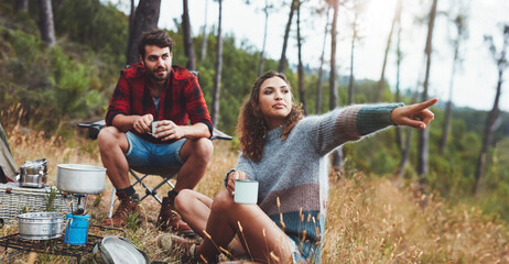 Young couple camping outdoors