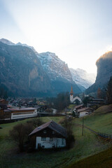 Fototapeta na wymiar Lauterbrunnen , Picturesque villages , town and valleys of Alps . Nice Staubbach Falls , Kirche , nature during autumn, winter : Lauterbrunnen , Switzerland : December 3 , 2019