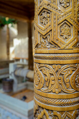 Fototapeta na wymiar Khiva, Uzbekistan - May 12, 2022: Traditional Oriental Design Details in the Ancient Uzbek Architecture