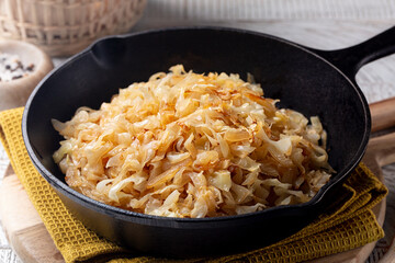 Quick Pan fried Sauerkraut or Crauti. Finely cut white cabbage cooked with fried onion and white...