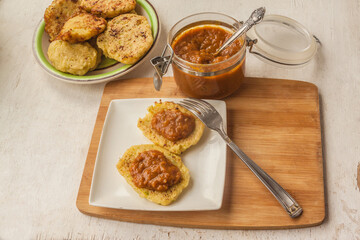 Zucchini pancakes and an apple chutney appetizer. Flat lay.