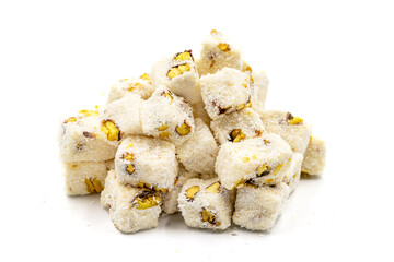 Turkish delight with milk. Turkish delight with pistachio and coconut isolated on a white background. Traditional middle eastern cuisine delicacies. close up