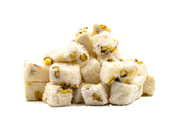 Turkish delight with milk. Turkish delight with pistachio and coconut isolated on a white background. Traditional middle eastern cuisine delicacies. close up