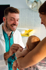 Pediatrician examining little baby to prevent diseases