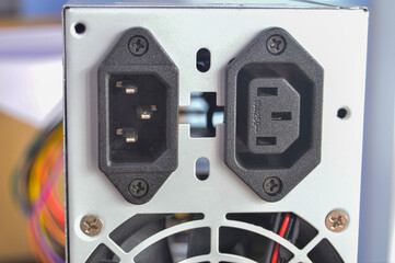 rear view of PC power supply There is a plug in the back.