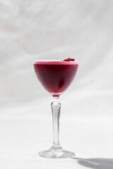 Vermouth with raspberry foam and rosebuds.