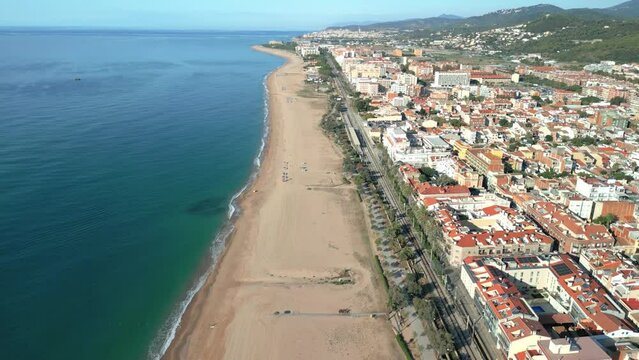 Aerial image of Malgrat de Mar beach in the province of Barcelona beach without people transparent turquoise blue sea