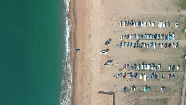 Genital images of a square with fishermen's boats aerial shot static image