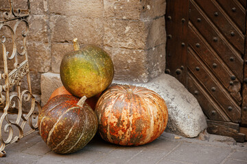 Pumpkin and rustic decoration outdoors. Stylish autumn decor of exterior building