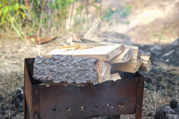 firewood for cooking on coals. firewood on the grill.