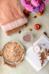 Homemade apple pie on a white background near the window close-up and copy space