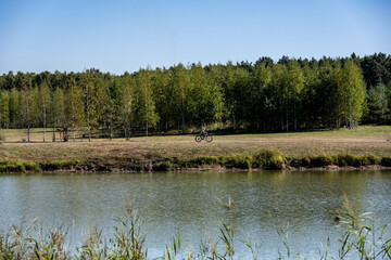 landscape with a river against a blue sky and a sunny day