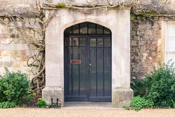 Arched Entrance Doorway in Stone Wall