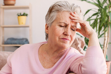 middle aged lady looking away sit alone at home feel anxious lonely, sad