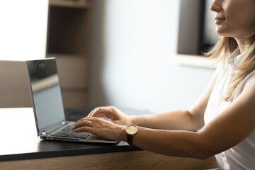 woman working on laptop close up