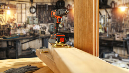 Drill on desk and workshop interior. 