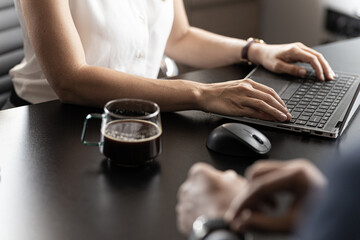 person working on laptop
close up womans hands on laptop