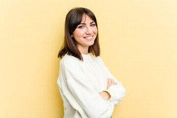 Fototapeta premium Young caucasian woman isolated on yellow background happy, smiling and cheerful.