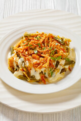cheesy green bean casserole on plate, top view