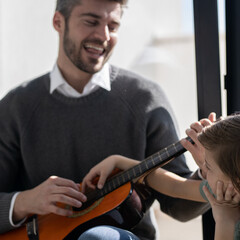 Father and son moments 
Father playing with his son in his room