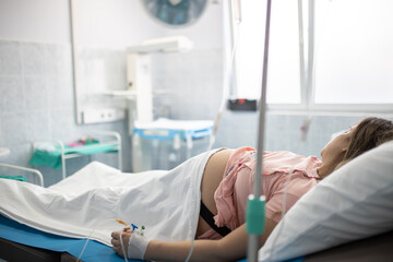 Woman in hospital prepairing for labor moment.
Giving birth, newborn baby