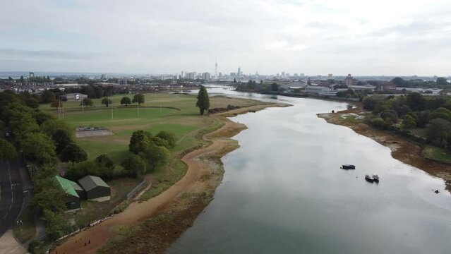 Aerial footage of lake Stoke in Gosport, England, in cloudy sky background