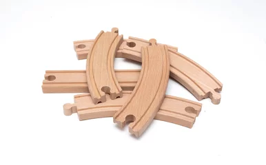 Poster wooden toy train track on isolated white background © bahadirbermekphoto