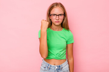 Caucasian teen girl isolated on pink background showing fist to camera, aggressive facial...