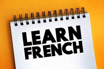 Learn French text on notepad, concept background