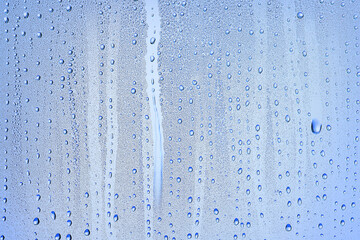 Naklejka na ściany i meble drops glass blue background abstract, transparent cold background water splashes