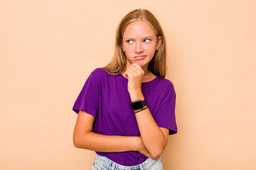 Caucasian teen girl isolated on beige background suffers pain in throat due a virus or infection.