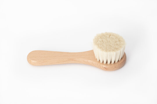 Hygiene care item: wooden brush with natural bristles. A brush on the cradle cap