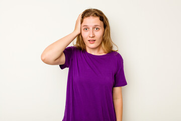 Young caucasian woman isolated on white background being shocked, she has remembered important...