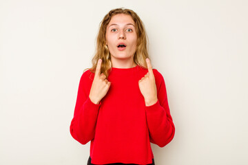 Fototapeta premium Young caucasian woman isolated on white background pointing upside with opened mouth.