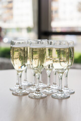 white wine glasses with fresh champagne, selective focus.