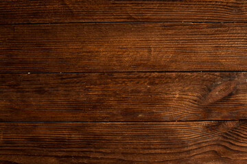 Vintage brown wood background texture with knots and nail holes. Old painted wood wall. Brown abstract background. Vintage wooden dark horizontal boards. Front view with copy space. Background for des