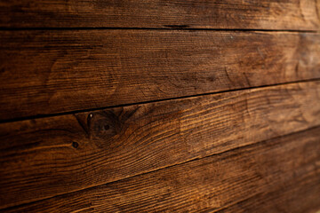 Vintage brown wood background texture with knots and nail holes. Old painted wood wall. Brown abstract background. Vintage wooden dark horizontal boards. Front view with copy space. Background for des