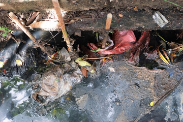 plastic waste and leaves cause ditches to clog and can lead to catastrophic floods