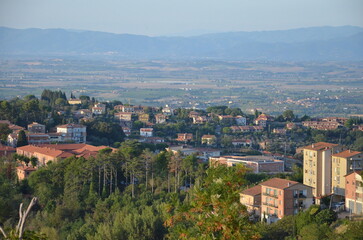 Fototapeta premium The beautiful countryside and town of Montepulciano in Tuscany on a bright summer day.