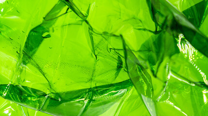 Plastic green bag texture background. Crumpled polyethylene texture. Waste recycle concept.