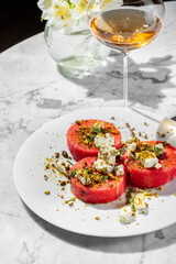 Watermelon with cheese and nuts