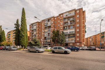 Fototapeta na wymiar Facades of urban residential houses in beehive street view