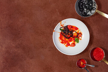 Spaghetti with cuttlefish ink and grilled octopus