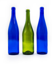Three bottles of wine. dark blue and turquoise. isolated on white background.