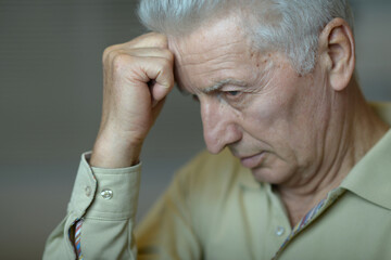 An elderly man in a state of depression.