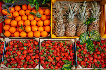 Fruit market counter with assortment of fresh fruits for sale