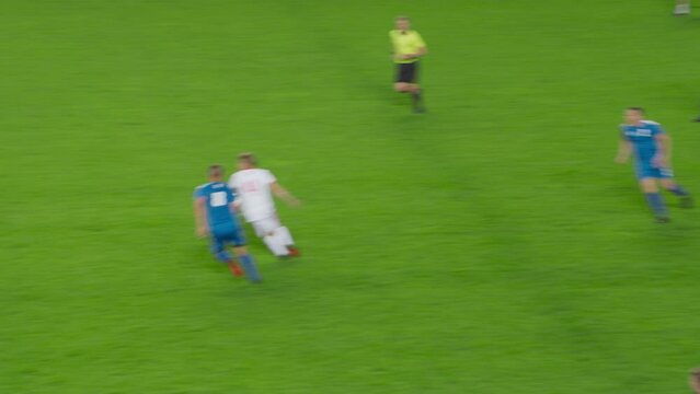 Professional Soccer Football Match Championship: Goalkeeper Throws Ball, White Team Attacks. World Tournament. Live Sport Broadcast Channel Television Playback Broadcast. Zoom out Tracking