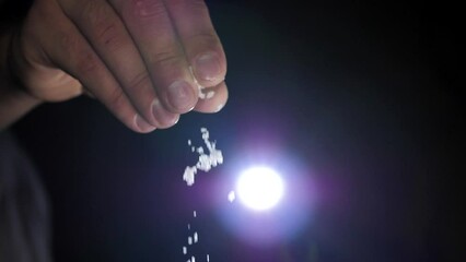 The chef adds salt to the dish, cooks in slow motion, prepares food