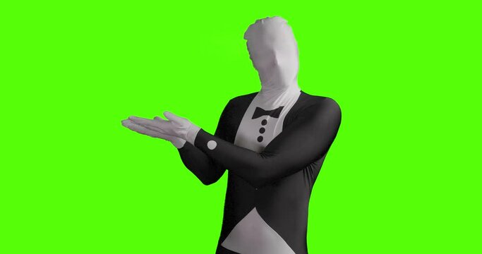 Static shot of a business morphsuit presenting something and showing his hands to the side against green background